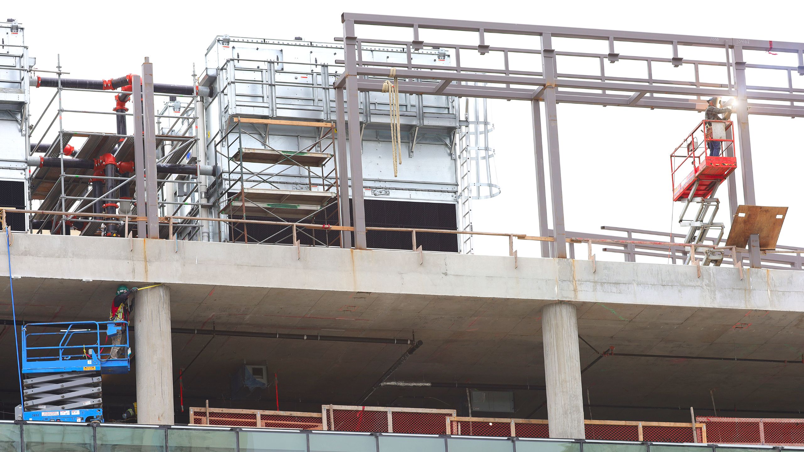 A building under construction with scaffolding on the top of it.